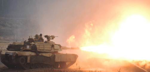 An Army M1A2 Abrams tank fires toward a simulated enemy during live-fire training in Pabrade, Lithuania, Jan. 14, 2020. - ALLOW IMAGES