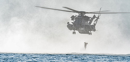 U.S. Marines with the All Domain Reconnaissance Detachment, 11th Marine Expeditionary Unit, leap from a CH-53E Super Stallion assigned to Marine Medium Tiltrotor Squadron 165, 11th MEU, during helocast training at Marine Corps Base Camp Pendleton, California, July 15, 2021. Helocasting is a method for quick and efficient entry into the water from a helicopter, during amphibious operations. U.S. Marine Corps photo by Cpl. Seth Rosenberg