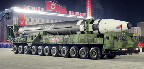 North Korea unveils seemingly new, larger ICBM at military parade. - ALLOW IMAGES