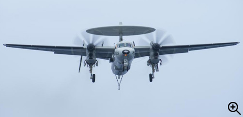 PACIFIC OCEAN (May 18, 2022) An E-2C Hawkeye, from the “Sun Kings” of Carrier Airborne Early Warning Squadron (VAW) 116, prepares to make an arrested gear landing on the flight deck of the aircraft carrier USS Nimitz (CVN 68). Nimitz is underway in the U.S. 3rd Fleet area of operations. (U.S. Navy photo by Mass Communication Specialist 3rd Class Jared Mancuso) - ALLOW IMAGES