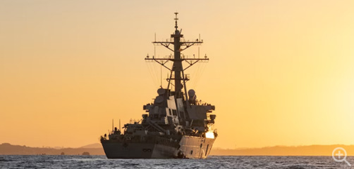 The USS Hopper sails at sunset following visit, board, search and seizure training conducted by Marines with the maritime raid force off the coast of Okinawa, Japan, Dec. 8, 2023.  Image: DoD  - ALLOW IMAGES