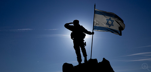 Israeli soldier on hilltop with national flag. Image: DepositPhotos.com - ALLOW IMAGES
