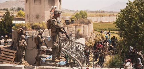 U.S. Marines guard the perimeter wall at Hamid Karzai International Airport, Kabul, Afghanistan.  ALLOW IMAGES