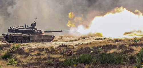 An Army M1 Abrams tank fires at a target during Defender-Europe at Drawsko Pomorskie Training Area, Poland, August 11, 2020. The exercise was designed to build strategic readiness. - ALLOW IMAGES