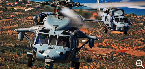Two Navy MH-60R Seahawk helicopters attached to Carrier Air Wing 7 fly over Athens, Greece, during Athens Flying Week, Sept. 17, 2022. The carrier air wing is the offensive air and strike component of Carrier Strike Group 10, George H.W. Bush Carrier Strike Group, which is on a scheduled deployment in the U.S. Naval Forces Europe area of operations to defend U.S., allied and partner interests.- ALLOW IMAGES