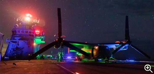 Service members conduct routine maintenance on a Marine Corps MV-22B Osprey aboard Royal Australian Navy HMAS Canberra during Rim of the Pacific, the world's largest international maritime exercise, in the Pacific Ocean, July 23, 2022. - ALLOW IMAGES