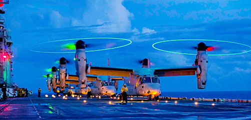 Marine Corps MV-22Bs prepare for takeoff aboard the USS America in the Philippine Sea, Aug. 17, 2021. - ALLOW IMAGES