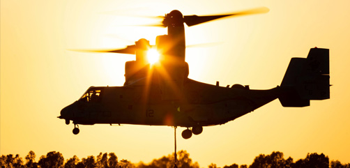 An MV-22B Osprey hoists a cargo net of tires during an external lift exercise at Morόn Air Base, Spain, July 9, 2020. - ALLOW IMAGES