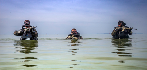 Marines patrol through water during a Marine Corps combat diving supervisor course at Camp Schwab, Okinawa, Japan, May 20, 2020. The course lasts two weeks and allows the Marines to be supervisors of their platoon while conducting diving operations. - ALLOW IMAGES