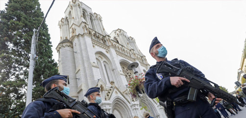 Police officers stand guard near Notre Dame church in Nice, southern France, Thursday, Oct. 29, 2020.  - ALLOW IMAGES