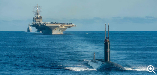 A U.S. fast-attack submarine steams ahead of the aircraft carrier USS Ronald Reagan and ships with the Korean navy and Japan Maritime Self-Defense Force during a tri-lateral anti-submarine warfare exercise off the coast of the Korean peninsula, Sept. 30, 2022. - ALLOW IMAGES