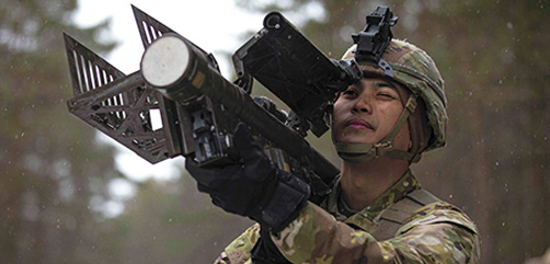 Army Sgt. Uelle Ballares aims a weapon during Rising Griffin, an exercise to maintain readiness, at Pabrade Training Area, Lithuania, April 6, 2022.  - ALLOW IMAGES