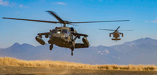 Army UH-60 Black Hawk helicopters transport Marines during Fuji Viper at Combined Arms Training Center, Camp Fuji, Japan, Jan. 21, 2021. The exercise allows units to improve proficiency in infantry and combined arms tactics. - ALLOW IMAGES