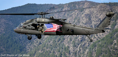 Army Spc. Jorge Lopez renders a salute for the American flag in Turkey, March 25, 2025. During the routine training flight, crews flew American flags that are being retired.  Image: DoD - ALLOW IMAGES