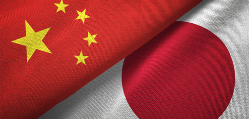 Chinese and Japanese flags side by side. Image via DepositPhotos.com - ALLOW IMAGES