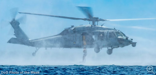 A Navy explosive ordnance disposal technician jumps from an MH-60S helicopter during the inaugural "Coconut Crab" competition in Guam, June 5, 2025.   Image: DoD - ALLOW IMAGES
