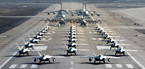 U.S. Air Force F-22 Raptors, E-3 Sentrys, C-17 Globemaster IIIs, C-130J Herculeses and C-12F Hurons participate in a close formation taxi known as an elephant walk at Joint Base Elmendorf-Richardson, Alaska, May 5, 2020.  (U.S. Air Force photo by Senior Airman Jonathan Valdes Montijo) - ALLOW IMAGES
