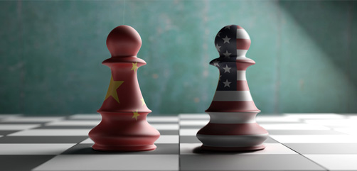 U.S and Chinese flag drapped chess pieces on board. Image: DepositPhotos.com- ALLOW IMAGES
