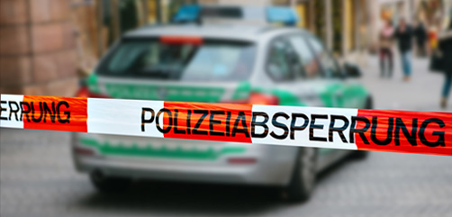 German police car behind crime scene tape.  Image: DepositPhotos.com - ALLOW IMAGES