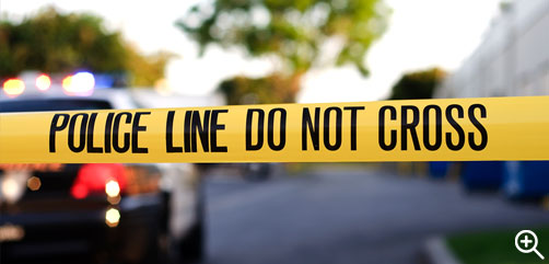 Click to Enlarge - Police tape limiting access to crime scene. - ALLOW IMAGES
