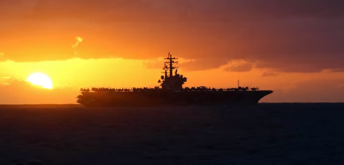 The aircraft carrier USS Ronald Reagan sails past the guided missile cruiser USS Robert Smalls before a replenishment in the Java Sea, July 14, 2023. Image: DoD - ALLOW IMAGES
