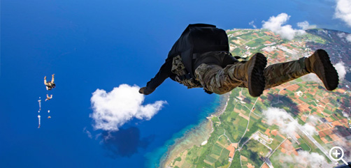 A sailor jumps out of an Air Force MC-130J Commando II during joint training over the coast of Japan, Aug. 5, 2022. - ALLOW IMAGES