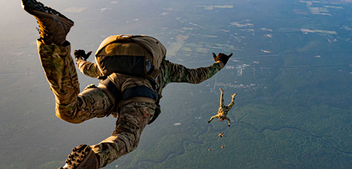 U.S. Air Force operators with the 492nd Special Operations Wing conduct a free-fall jump mission out of the back of an MC-130J Commando II assigned to the 27th Special Operations Wing during an Emerald Warrior 22.1 mission over Eglin Range, Fla., May 4, 2022. Emerald Warrior is the largest joint special operations exercise involving U.S. Special Operations Command forces training to respond to various threats across the spectrum of conflict. (U.S. Air Force photo by Senior Airman Harrison Winchell)  - ALLOW IMAGES