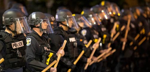 Louisville Metro Police face off with protesters.  - ALLOW IMAGES