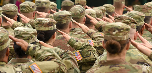 A formation of US Army soldiers render a salute. Image: DoD - ALLOW IMAGES