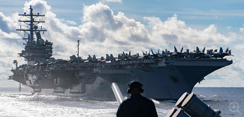 Seaman Marcus White, from San Diego, stands watch as aft lookout aboard the Ticonderoga-class guided-missile cruiser USS Chancellorsville (CG 62) during a replenishment-at-sea with the Nimitz-class aircraft carrier USS Ronald Reagan (CVN 76). Chancellorsville is forward-deployed to the U.S. 7th Fleet area of operations in support of security and stability in the Indo-Pacific region. (U.S. Navy photo by Mass Communication Specialist 2nd Class John Harris/Released) - ALLOW IMAGES