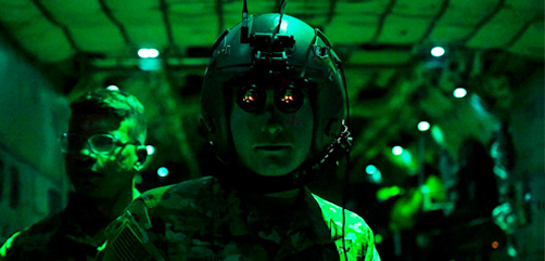 An airman uses night vision goggles during night operations at Pope Army Airfield, N.C., Feb. 11, 2022. - ALLOW IMAGES