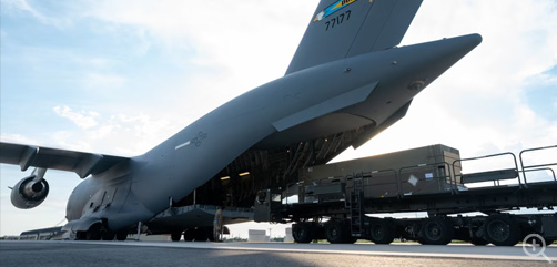 Weapons bound for Ukraine are loaded onto a C-17 Globemaster III during a security assistance mission at Dover Air Force Base, Del., Aug. 19, 2022. On Aug. 14, the DoD announced another security assistance package valued at up to $200 million to help Ukraine counter Russia's ongoing war of aggression. The package includes critical munitions for U.S.-provided Patriot air defense systems and High Mobility Artillery Rocket Systems, among other items. Image: DoD - ALLOW IMAGES