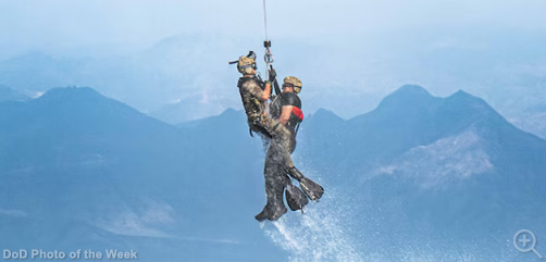 An airman recovers personnel in the water during Bull Shark in Djibouti, Nov. 26, 2024. The exercise simulated multiple personnel recovery scenarios in water, allowing for the coordination of land, sea and air components from the U.S. military, the Spanish navy and the Djiboutian coast guard. - ALLOW IMAGES