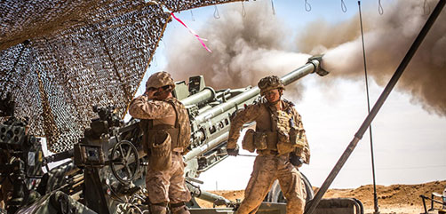 Marines with the 11th Marine Expeditionary Unit fire an M777 Howitzer during a fire mission in northern Syria as part of Operation Inherent Resolve, March 24, 2017.