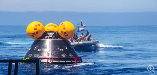 Sailors tow the Vehicle Advanced Demonstrator for Emergency Recovery, a replica of the Orion crew module, into the Pacific Ocean, July 26, 2023, for underway recovery testing to prepare for NASA's Artemis II crewed mission that will send four astronauts beyond the moon. The Navy and NASA will conduct a series of tests to demonstrate and evaluate the processes, procedures and hardware used in recovery operations for crewed lunar missions. 
Image: DoD - ALLOW IMAGES