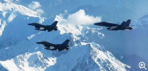 An Air Force F/A-18E Super Hornet and two Greek F-16s fly over Greece, Feb. 22, 2023, during combined long range strike training in Greece. Image: DoD