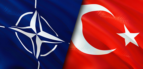 NATO flag draped over national flag of Turkey.  - ALLOW IMAGES