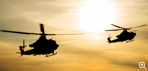 A UH-1Y Venom helicopter, left, and AH-1Z Viper helicopter descend to land near Saaremaa, Estonia, May 22, 2022.  - ALLOW IMAGES